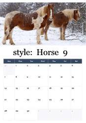 Paint horses standing together in winter snowfall