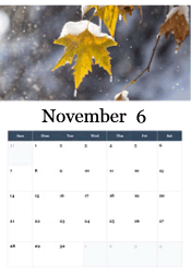 First snow on autumn maple leaf November calendar
